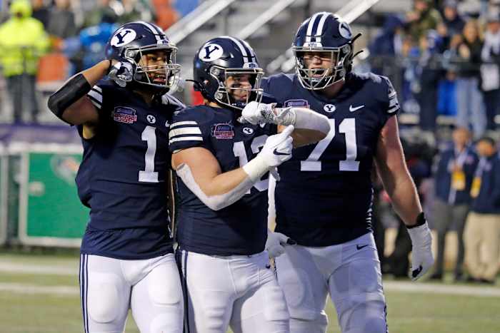 Dec 18, 2021; Shreveport, LA, USA; BYU Cougars wide receiver Keanu Hill (1), tight end Masen Wake (13), and offensive linemen Blake Freeland (71) react after a big gain to the one yard line to setup a touchdown during the fourth quarter against the UAB Blazers during the 2021 Independence Bowl at Independence Stadium. Mandatory Credit: Petre Thomas-USA TODAY Sports